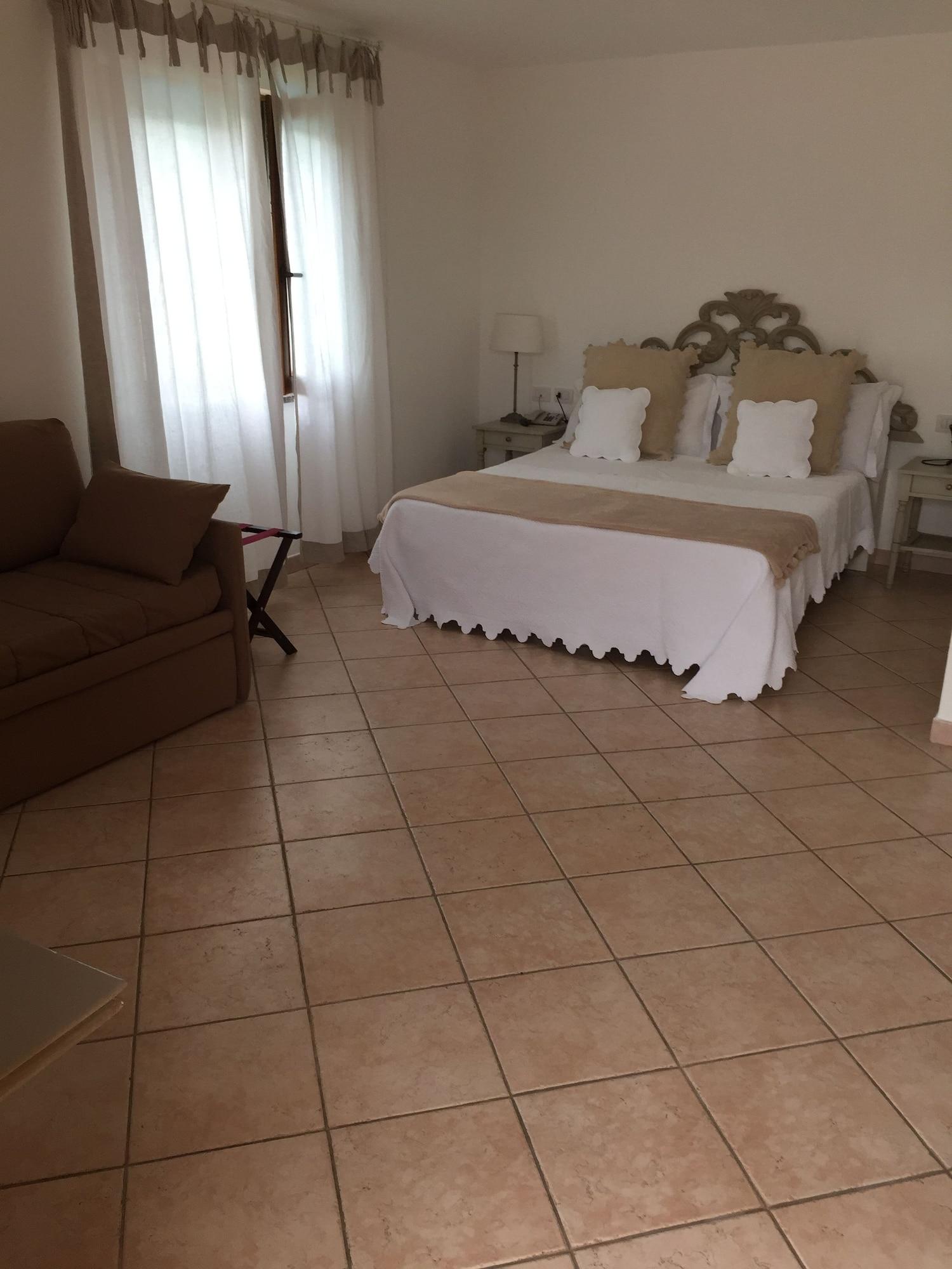 Relais Fenicottero Rosa Guest House Porto Taverna Bagian luar foto