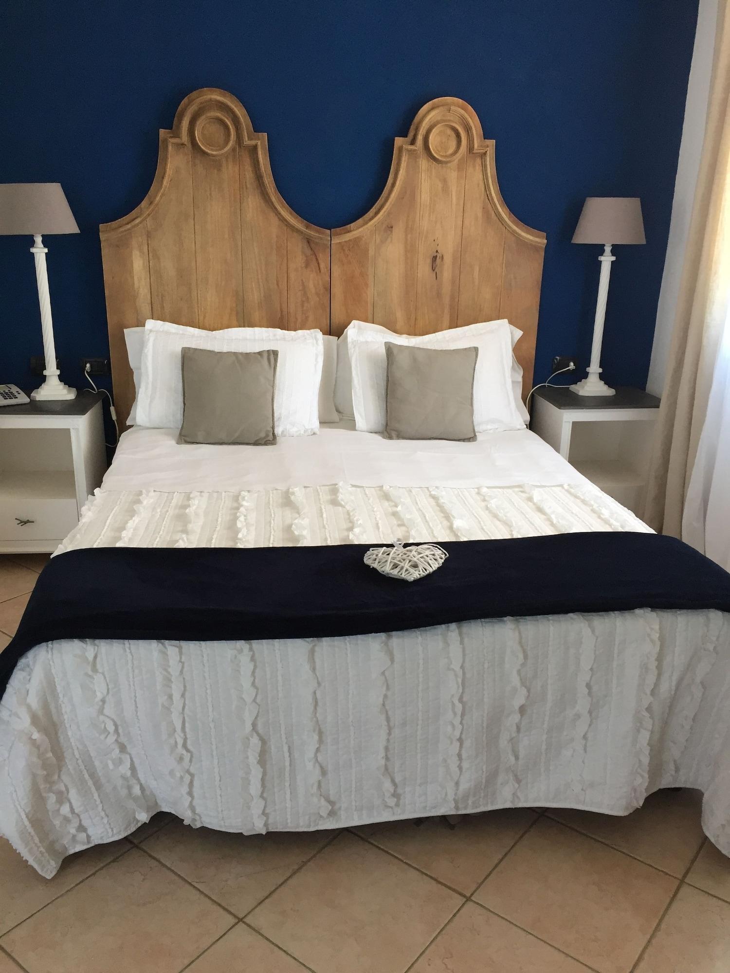 Relais Fenicottero Rosa Guest House Porto Taverna Bagian luar foto