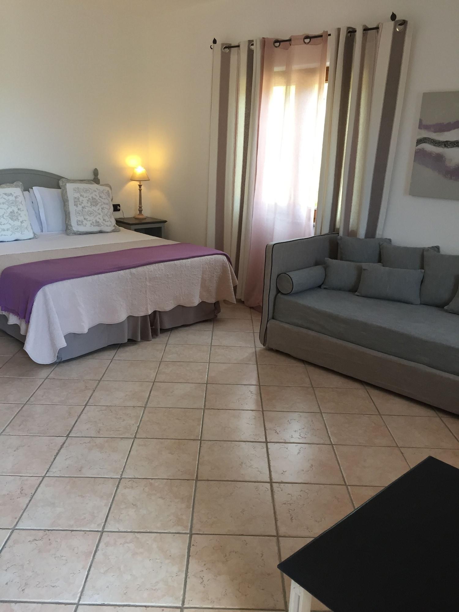 Relais Fenicottero Rosa Guest House Porto Taverna Bagian luar foto